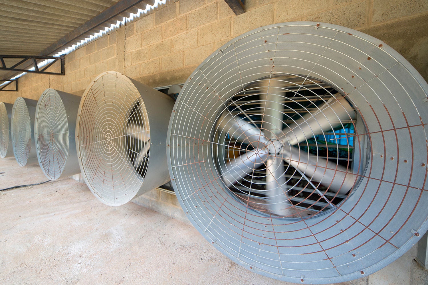 Big industrial cooler fans or cooler fans big engine in factory for reduced heat in operation.