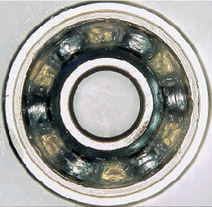 Deep groove ball bearing with grease packed inside.